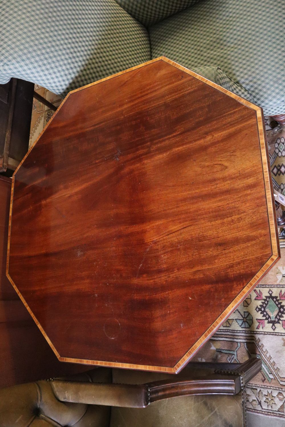 An Edwardian satinwood banded octagonal mahogany centre table, width 91cm depth 73cm